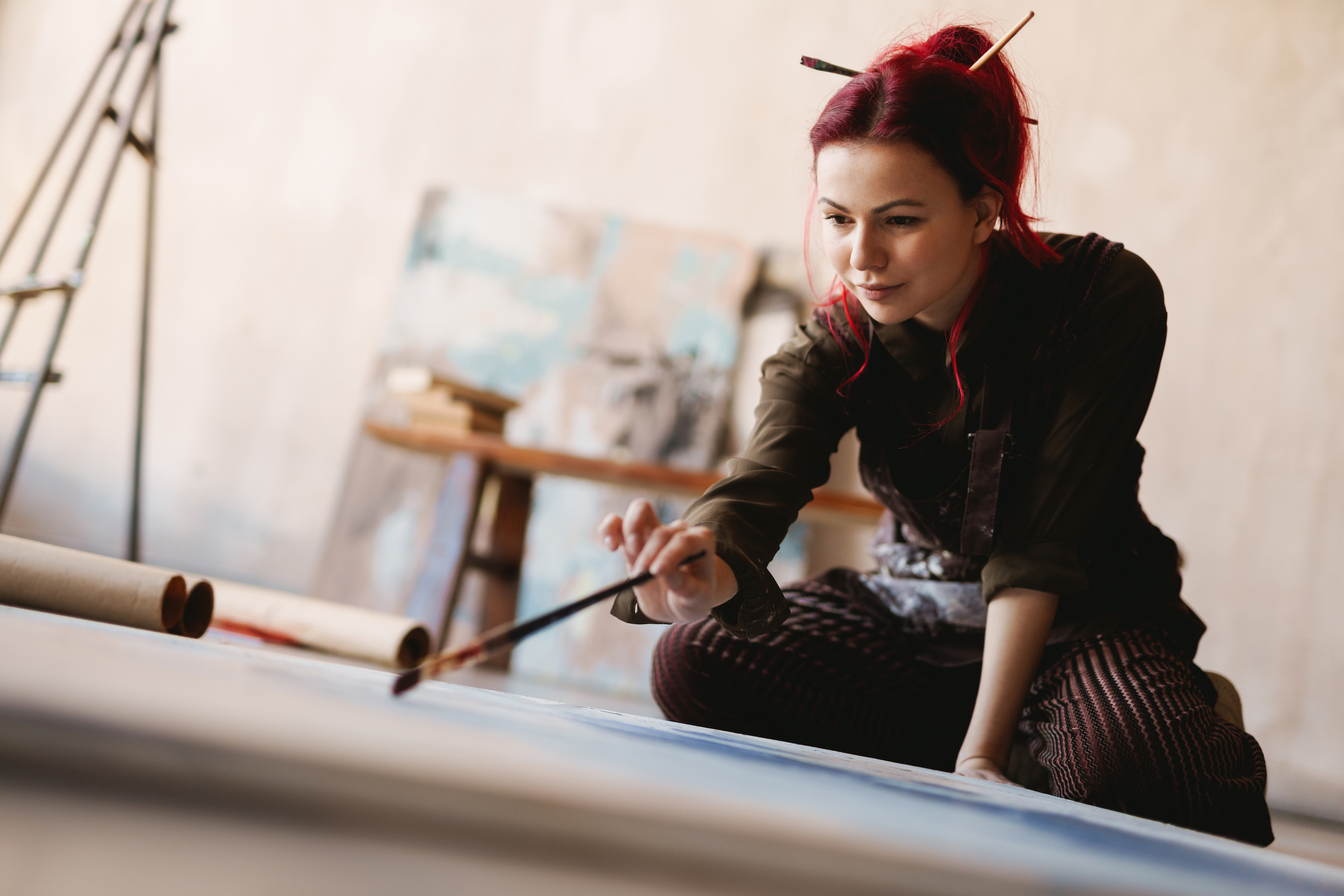 Young woman painting in an art studio