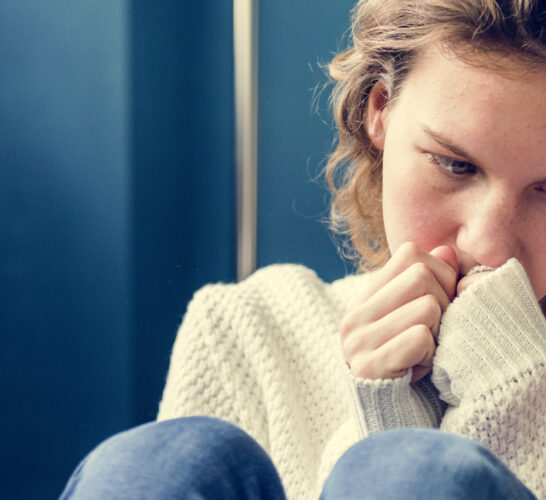 Young girl feeling alone during a mental health crisis for teens