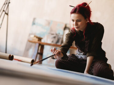 Young woman painting in an art studio